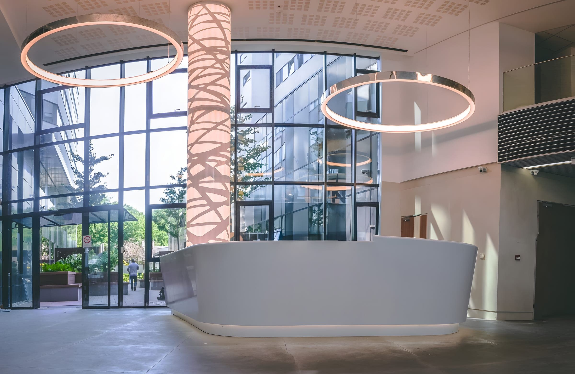 The bright double-height lobby and reception desk